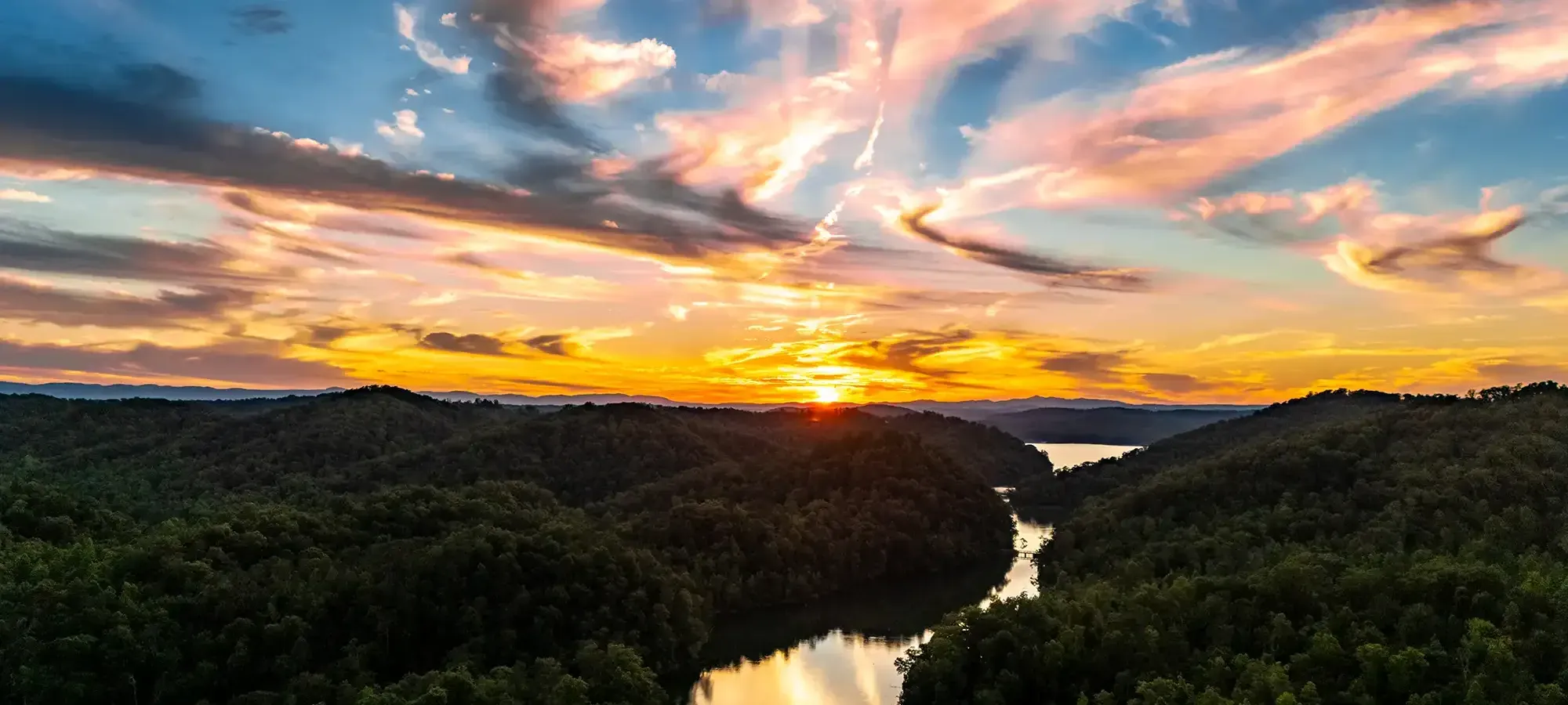 Sunset over the Tennessee River and wooded ridges